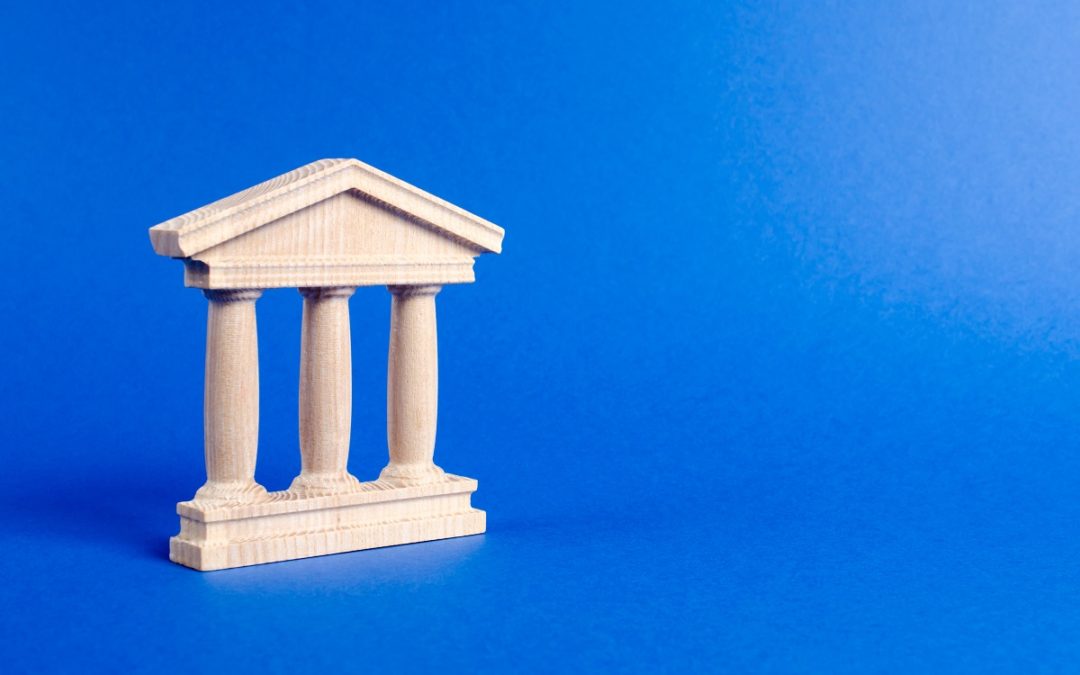three pillars on blue background